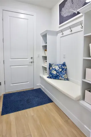 a utility room with cabinets washer and dryer
