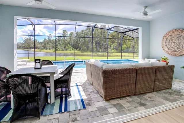 a view of a swimming pool with a porch