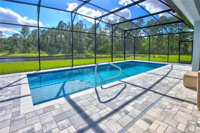 a view of a swimming pool with a patio