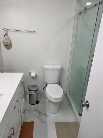 a bathroom with a toilet and a sink