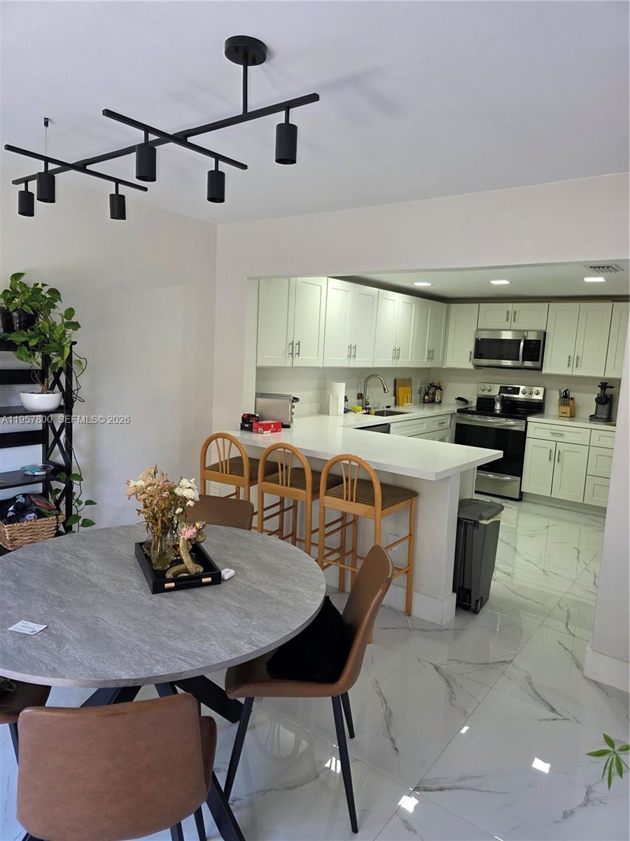 6904 Southwest 114th Place, Unit C58 Miami, FL 33173 - Photo 5 of 27 off kitchen