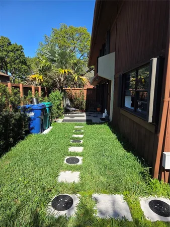 a view of yard with patio