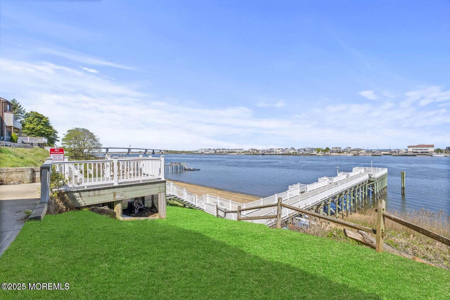 200 Portland Road, Unit B22 Highlands, NJ 07732 - Photo 23 of 35 a view of a roof deck with couches and wooden fence