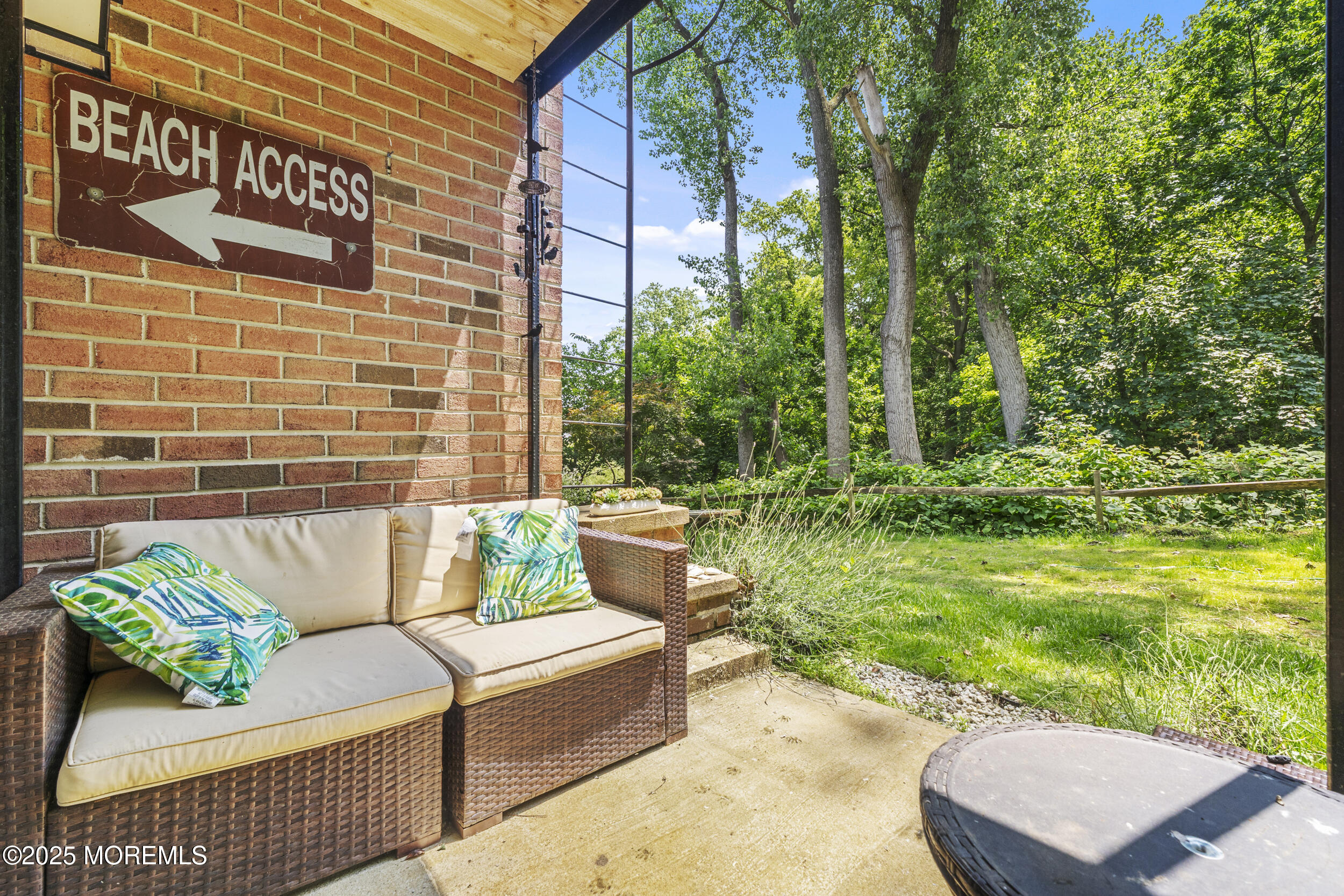 200 Portland Road, Unit B22 Highlands, NJ 07732 - Photo 5 of 35 a view of a patio with couches table and chairs and potted plants