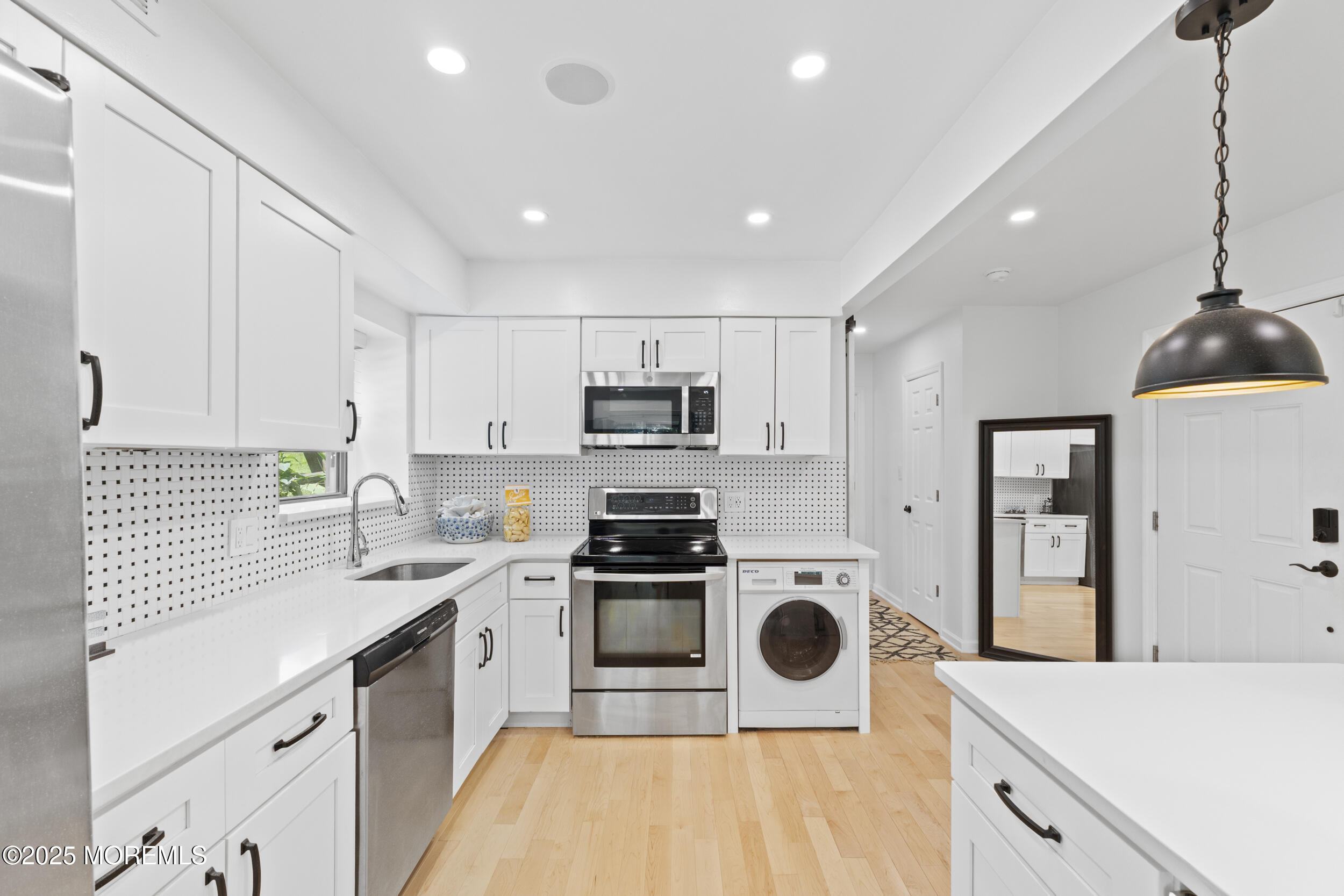 200 Portland Road, Unit B22 Highlands, NJ 07732 - Photo 8 of 35 a kitchen with a sink a stove and refrigerator