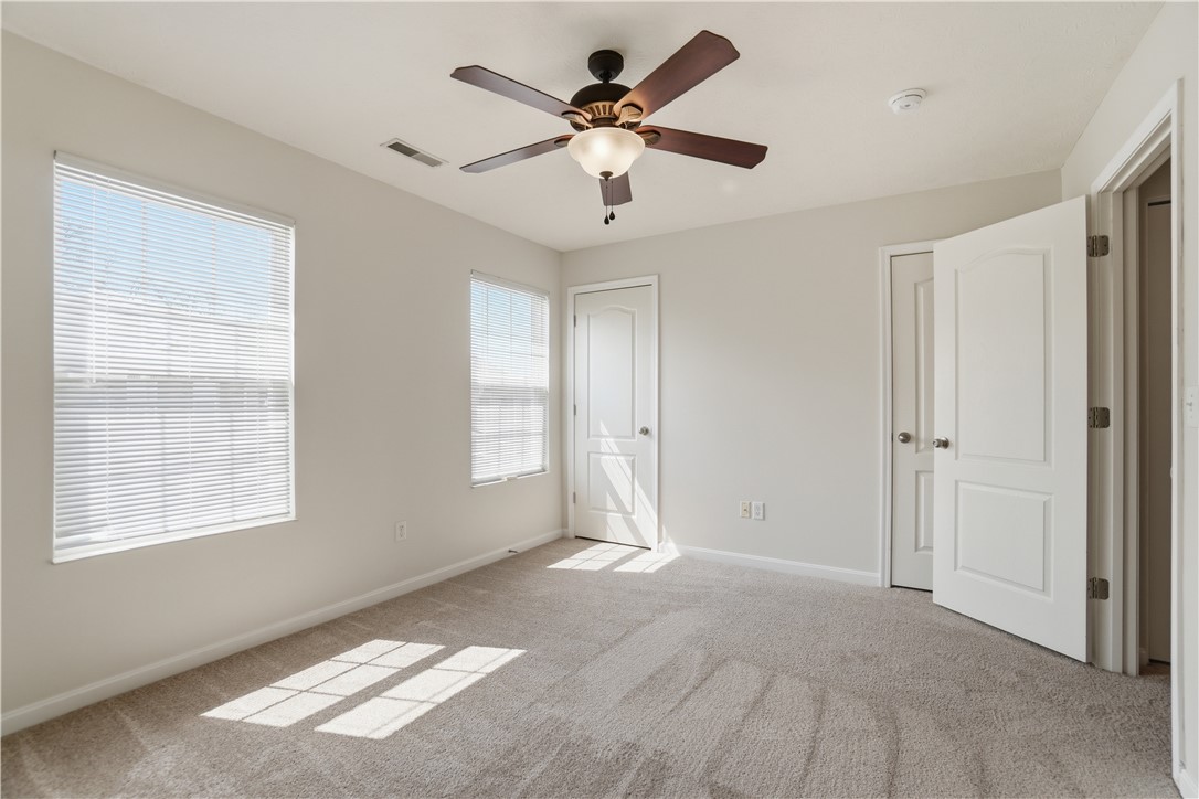 4294 Straight Arrow Road Dayton, OH 45430 - Photo 24 of 41 This spacious bedroom offers ample natural light and a comfortable atmosphere for relaxation.