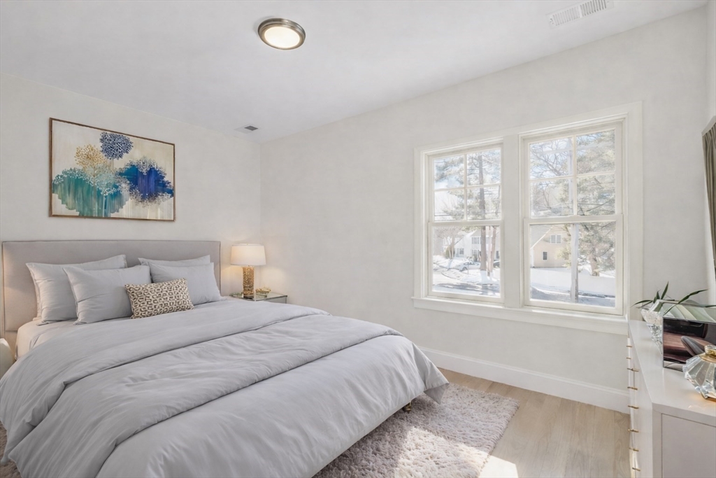 510 Common Street Walpole, MA 02081 - Photo 18 of 35 a bedroom with a bed and a window