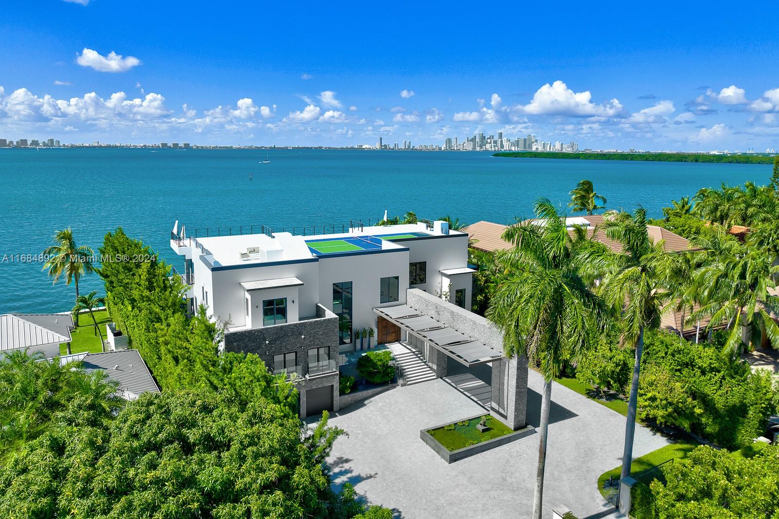 330 Harbor Drive Key Biscayne, FL 33149 - Photo 1 of 32 a view of a lake with a building in the background