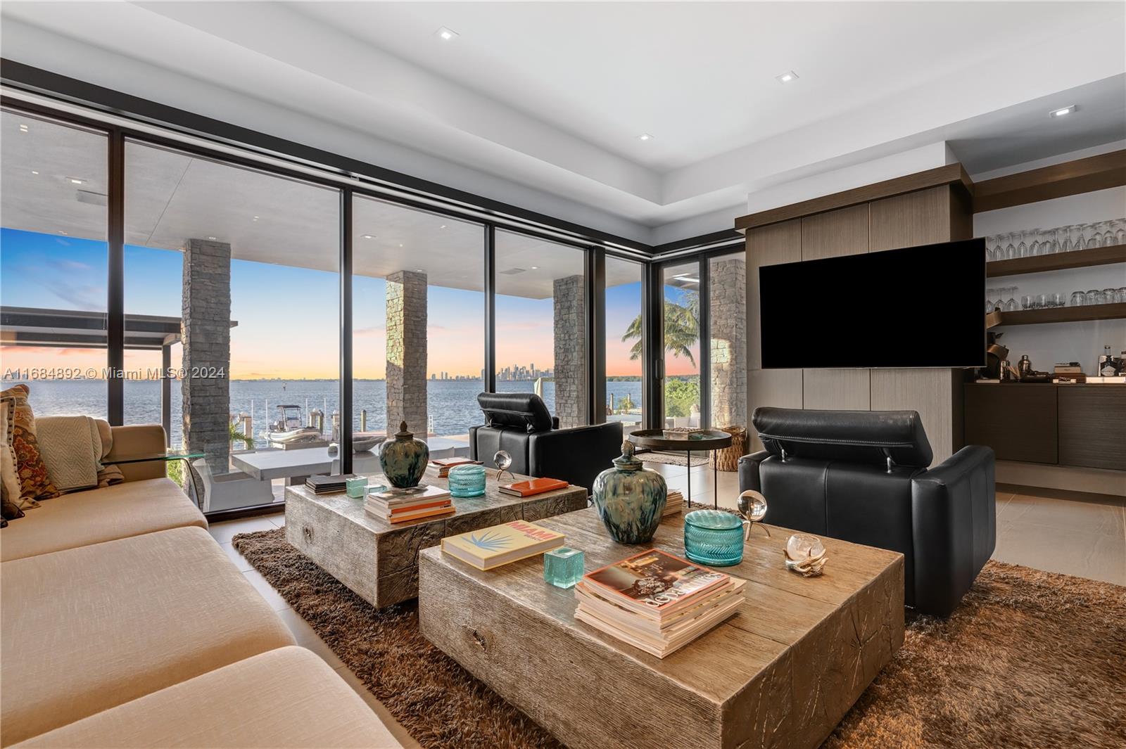 330 Harbor Drive Key Biscayne, FL 33149 - Photo 3 of 32 a living room with fireplace furniture and a flat screen tv