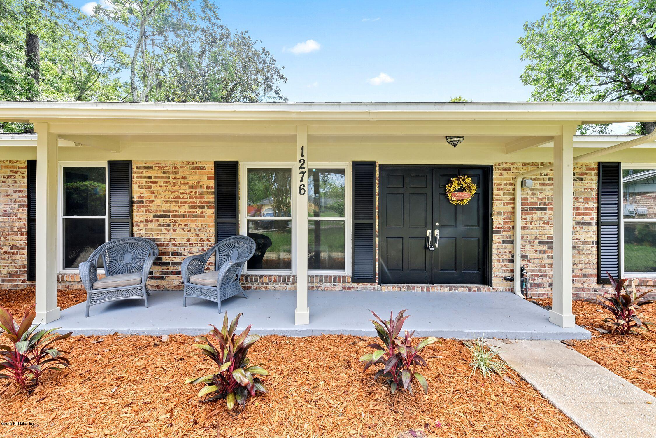 1276 Arbor Circle Orange Park, FL 32073 - Photo 2 of 23 a view of a patio with table and chairs and potted plants