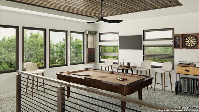 a living room with furniture a flat screen tv and a large window