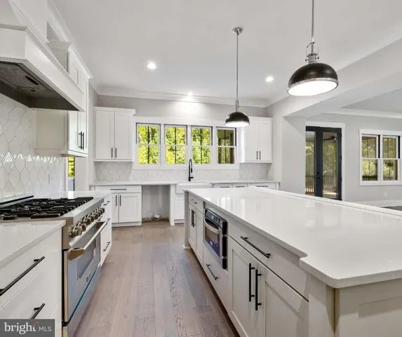 a large kitchen with a stove