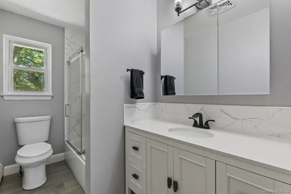 a kitchen with stainless steel appliances granite countertop a refrigerator sink and cabinets