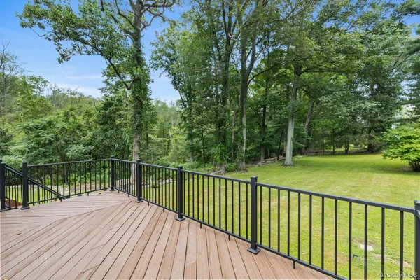 a view of a backyard with sitting area