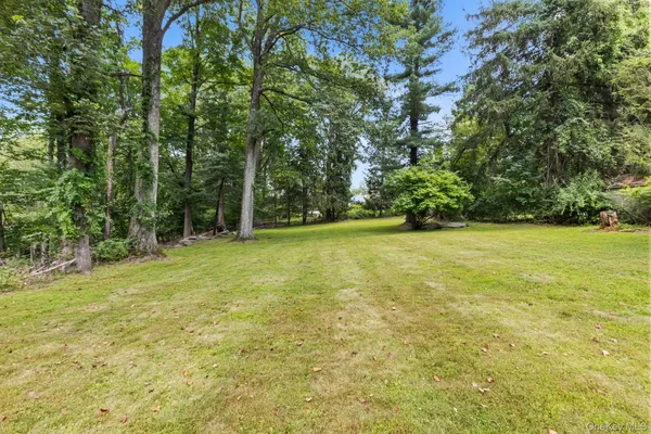 a view of balcony with wooden floor and fence