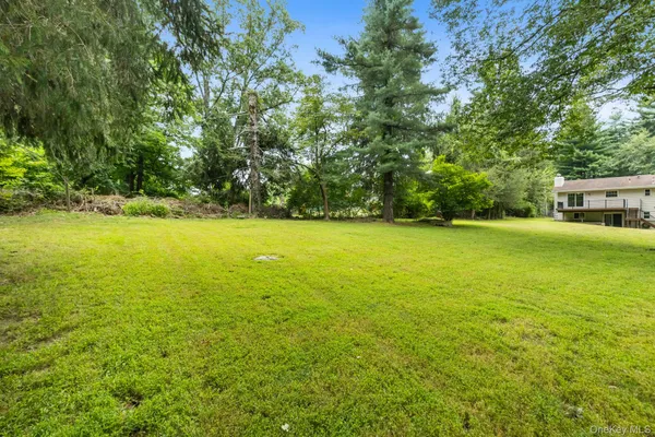 a view of a field with trees in front of it