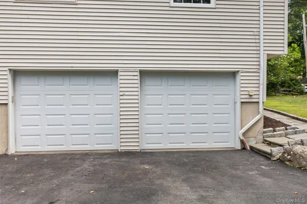 a view of a large body of water with lawn chairs under an umbrella