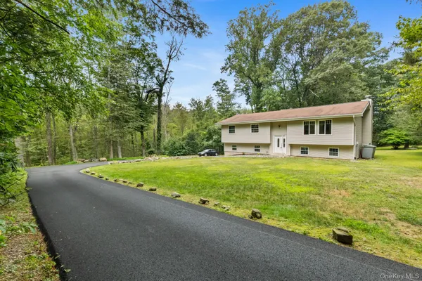 a view of outdoor space with deck and yard