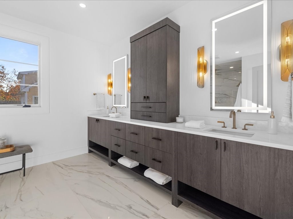 166 Wiswall Road Newton, MA 02459 - Photo 27 of 42 a bathroom with a double vanity sink and a mirror