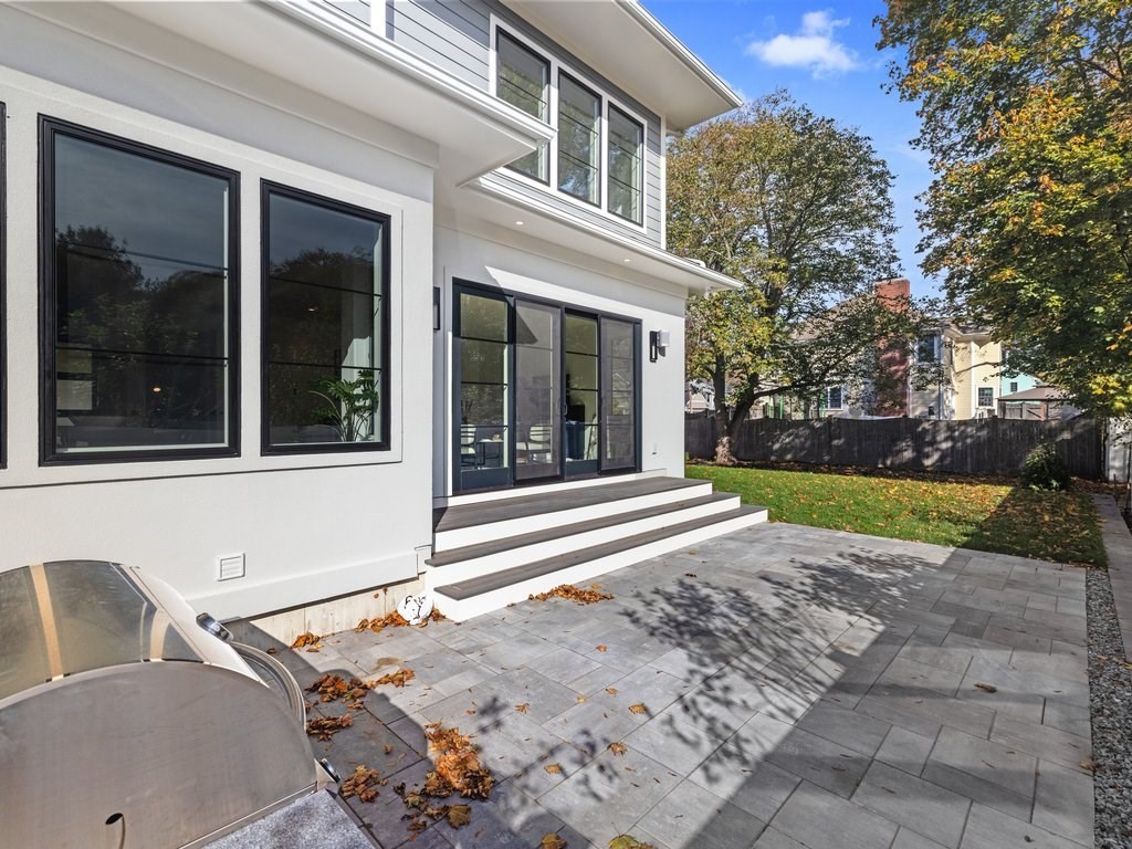 166 Wiswall Road Newton, MA 02459 - Photo 39 of 42 a view of a house with a backyard