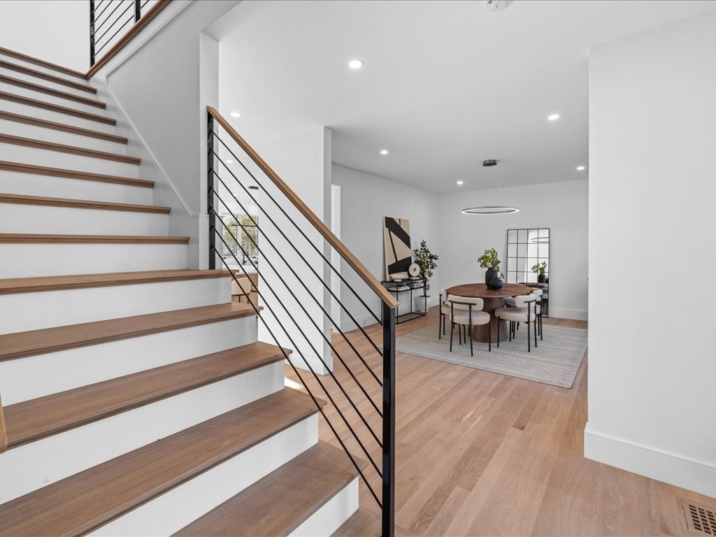 166 Wiswall Road Newton, MA 02459 - Photo 4 of 42 a view of entryway and hall with wooden floor