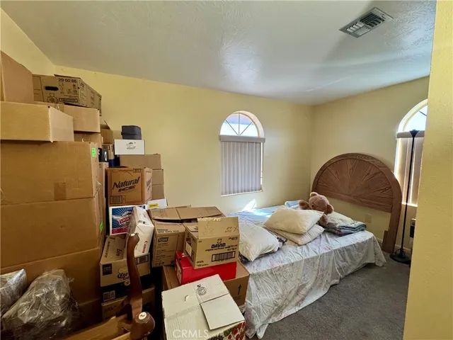 a bedroom with furniture and a bed