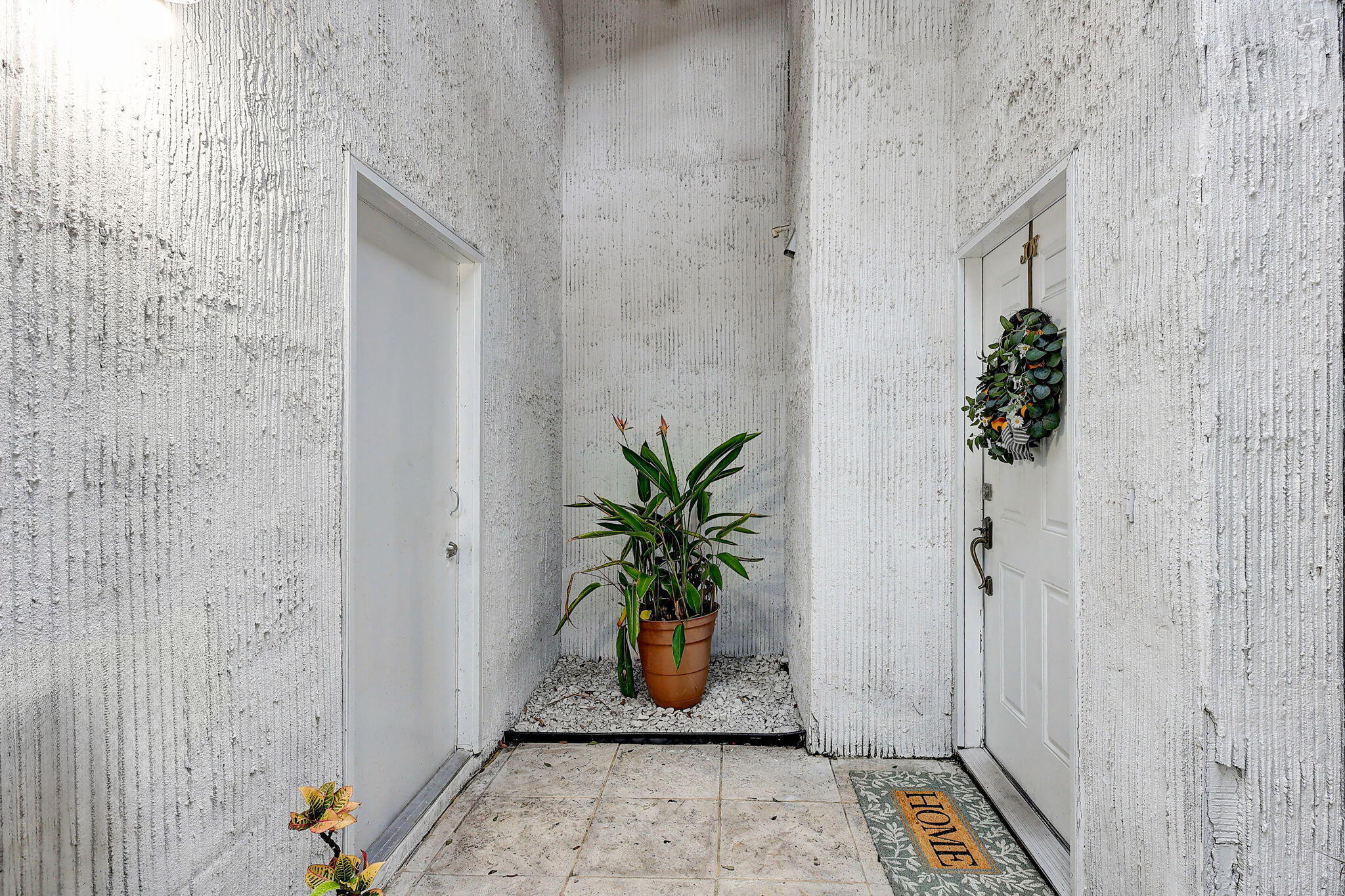 2020 Colonial Road, Unit 6 Fort Pierce, FL 34950 - Photo 4 of 31 Garage Entry & Home Entry