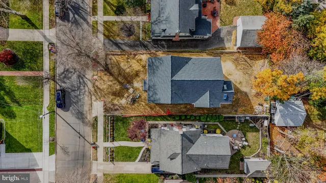 a aerial view of a house with large trees