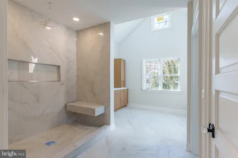 a view of a bathroom with mirror