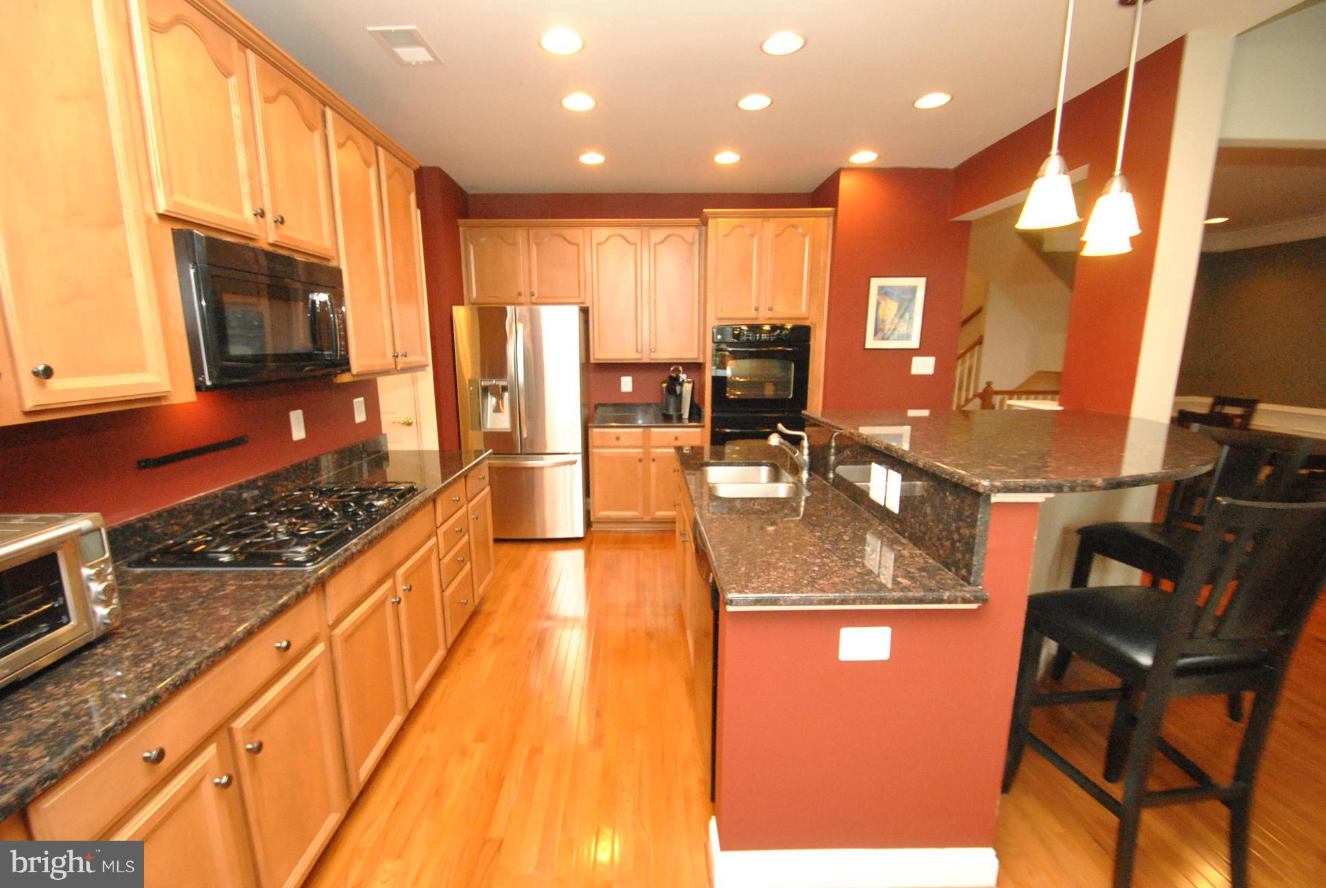 5121 Bright Owl Road Perry Hall, MD 21128 - Photo 9 of 30 GOURMET KITCHEN W/GRANITE ISLAND & BREAKFAST BAR