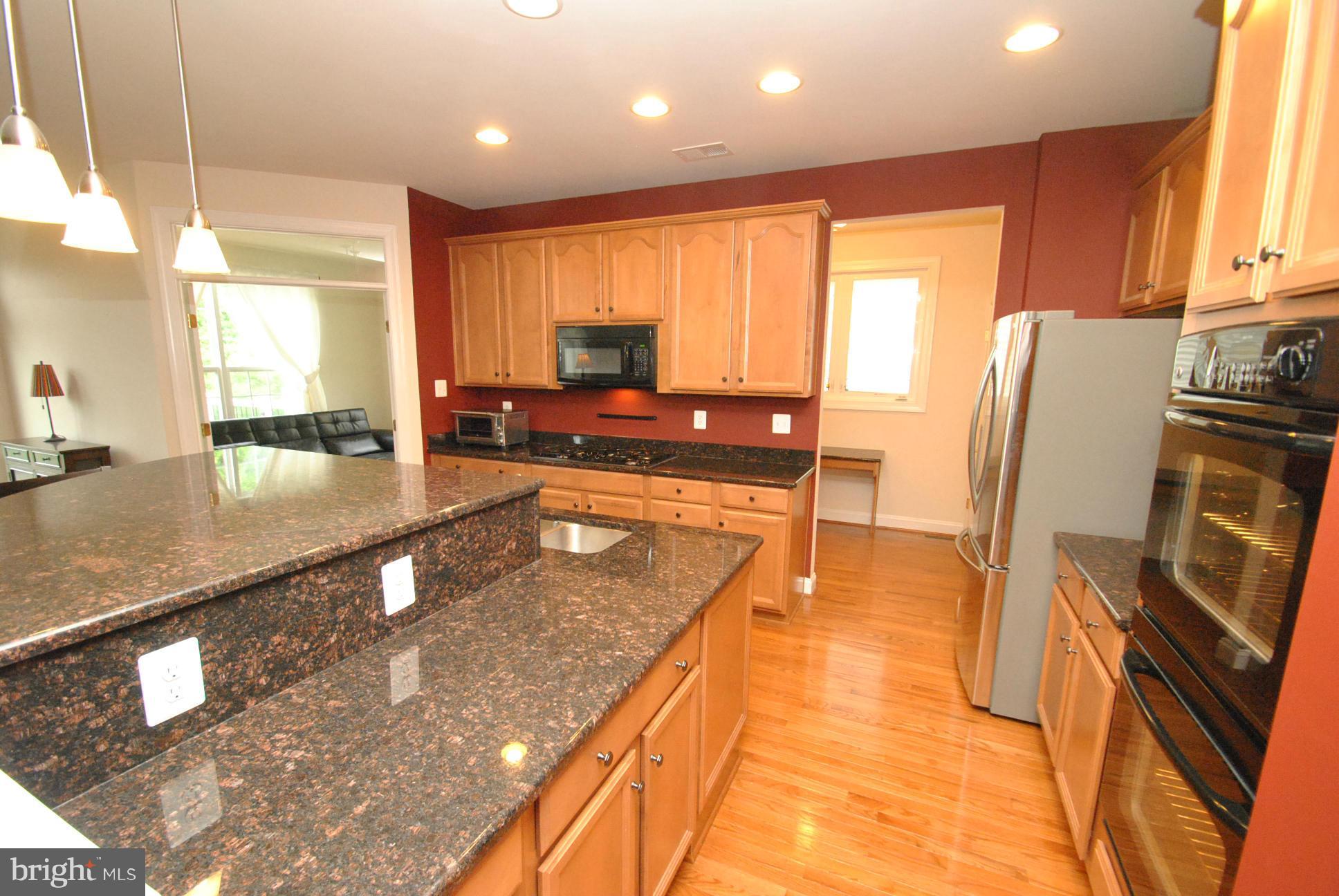 5121 Bright Owl Road Perry Hall, MD 21128 - Photo 10 of 30 GOURMET KITCHEN W/GRANITE ISLAND & BREAKFAST BAR