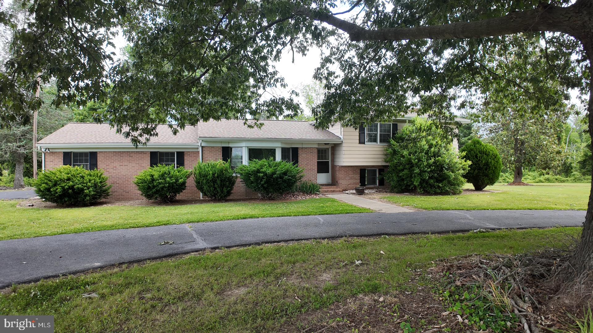 8936 Goldsborough Neck Road Easton, MD 21601 - Photo 4 of 13 a front view of a house with a yard