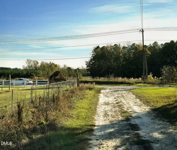 a view of a swimming pool with a yard