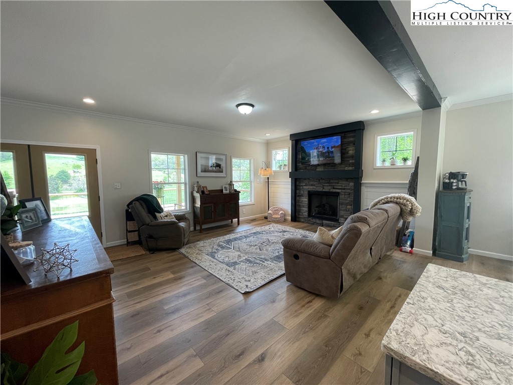 878 Ballou Farm Road Crumpler, NC 28617 - Photo 17 of 45 a living room with furniture a flat screen tv and a fireplace
