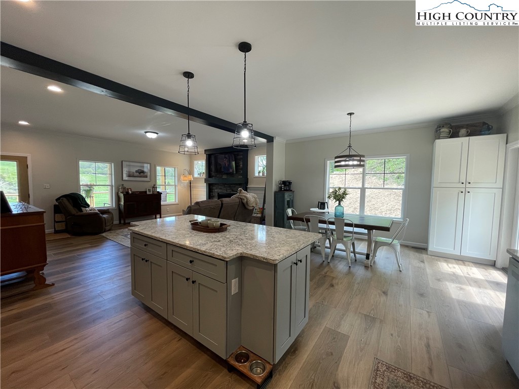 878 Ballou Farm Road Crumpler, NC 28617 - Photo 25 of 45 a large kitchen with lots of counter space a sink appliances and dining table