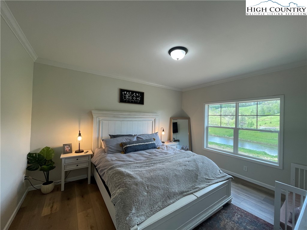 878 Ballou Farm Road Crumpler, NC 28617 - Photo 28 of 45 a bedroom with a bed and a large window