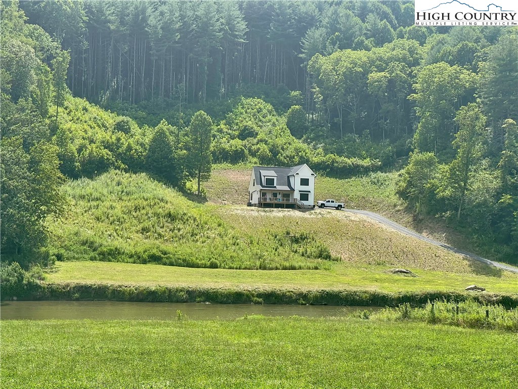 878 Ballou Farm Road Crumpler, NC 28617 - Photo 3 of 45 a view of swimming pool with a yard