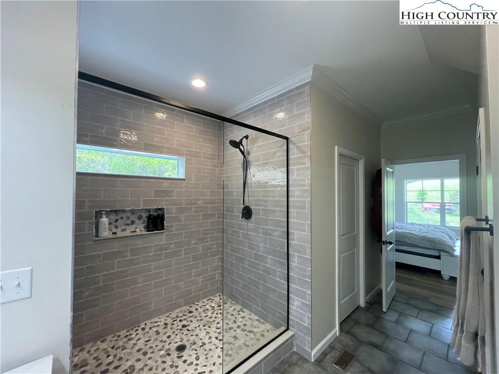 878 Ballou Farm Road Crumpler, NC 28617 - Photo 32 of 45 a bathroom with a shower and a sink