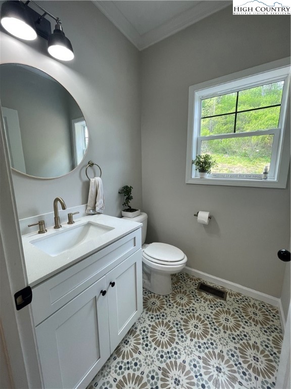 878 Ballou Farm Road Crumpler, NC 28617 - Photo 36 of 45 a bathroom with a toilet a sink and a mirror