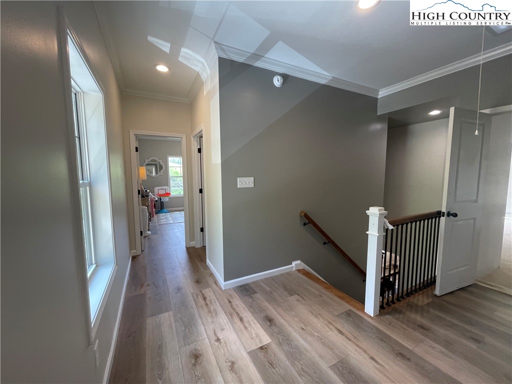878 Ballou Farm Road Crumpler, NC 28617 - Photo 38 of 45 a view of a hallway with wooden floor and staircase