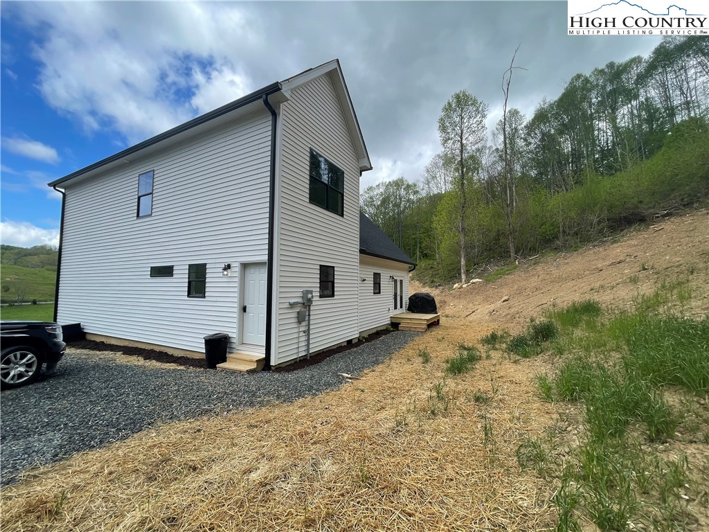 878 Ballou Farm Road Crumpler, NC 28617 - Photo 44 of 45 a view of a house with backyard