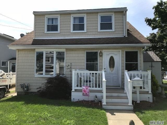 202 Shore Road Bellmore, NY 11710 - Photo 1 of 1 a front view of house with yard