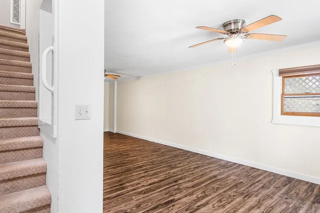 a view of an entryway with wooden floor