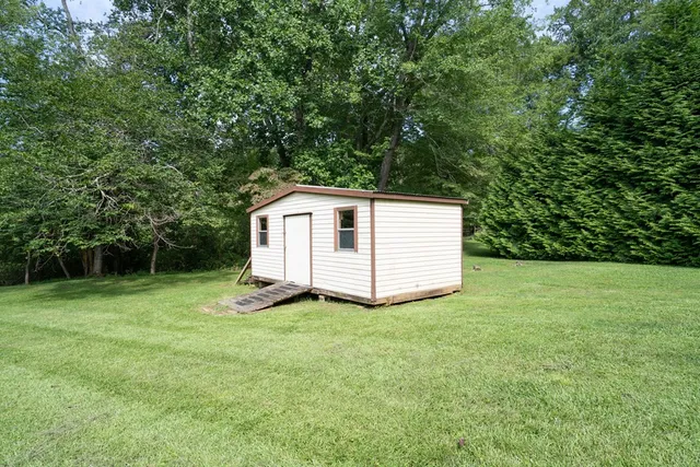 a room with wooden furniture and a table