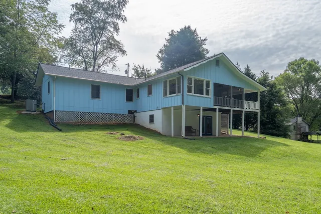 a house with trees in the background