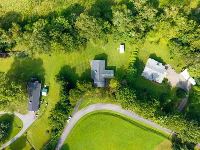 a view of backyard with green space