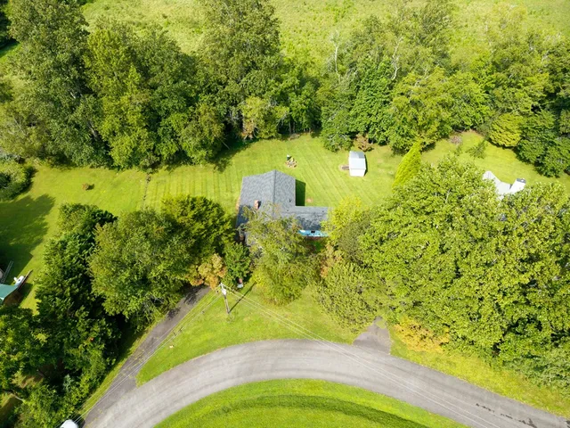 an aerial view of residential house with outdoor space