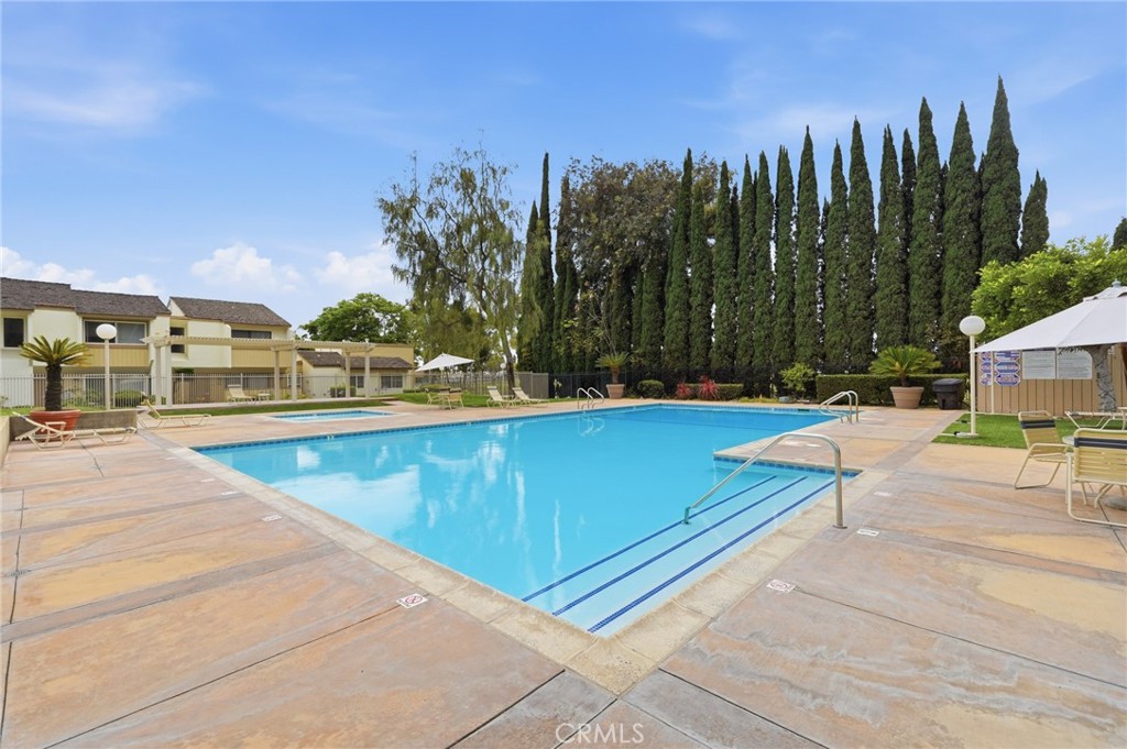 259 Scenic Way Brea, CA 92821 - Photo 53 of 62 a view of a swimming pool with an outdoor seating and a garden