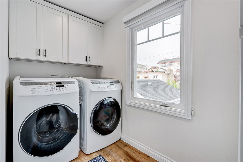 825 Center Street El Segundo, CA 90245 - Photo 36 of 52 a view of washer and dryer with bathroom in the background