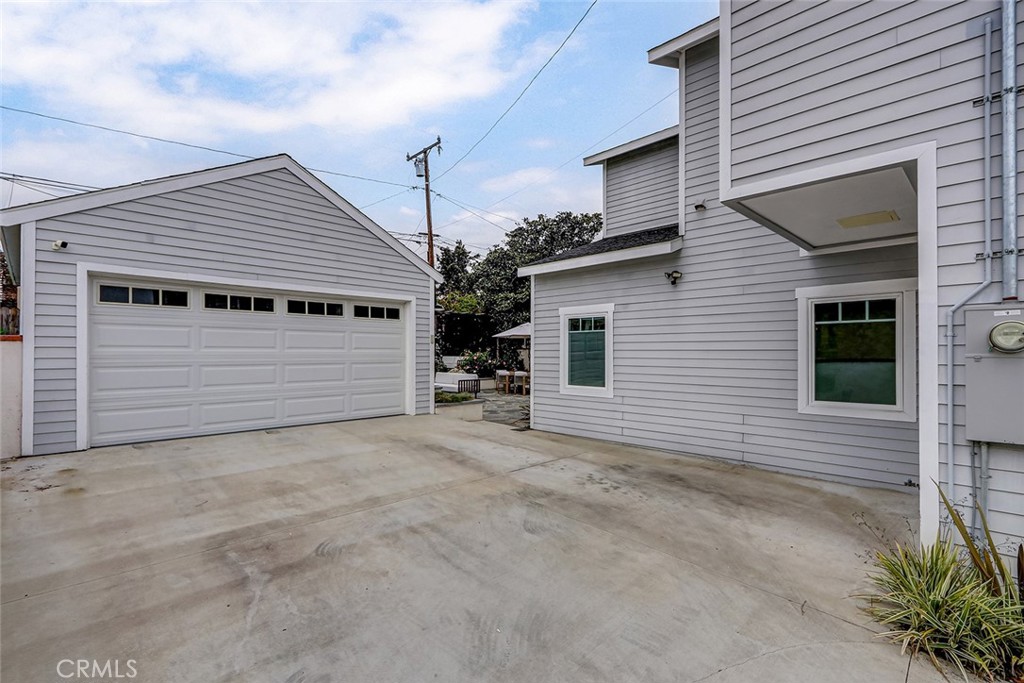 825 Center Street El Segundo, CA 90245 - Photo 42 of 52 a view of a house with a yard and garage